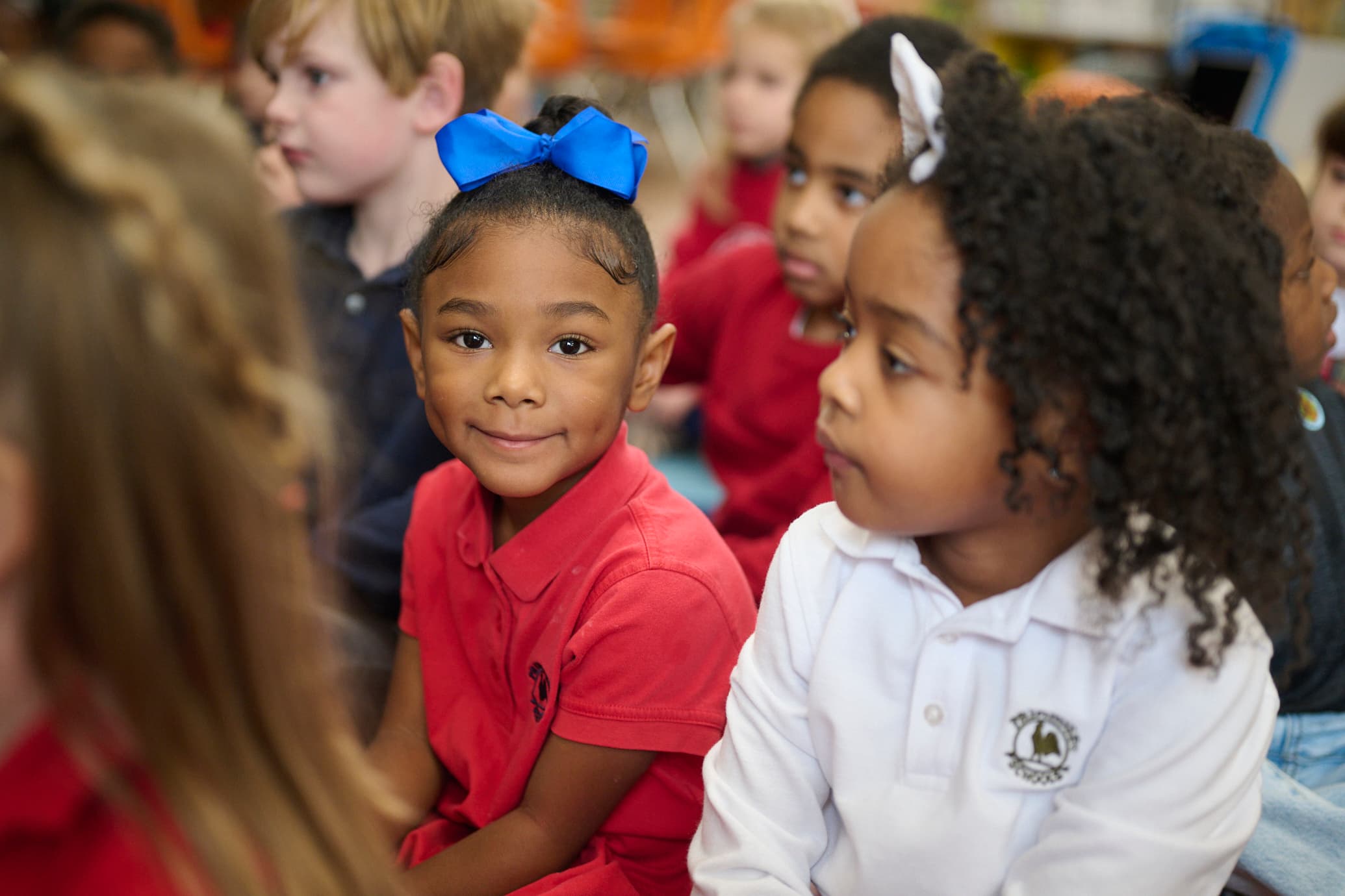 kindergarten child smiling with classmates